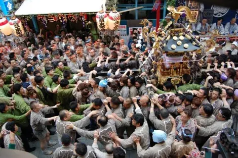 The religious parade begins on Saturday afternoon about a hundred secondary mikoshi gather at Asakusa Shrine.